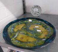 A GREEN AND GOLD STUDIO GLASS CIRCULAR PLAQUE, 12 ¼? DIAMETER AND A CLEAR GLASS GLOBULAR DOOR