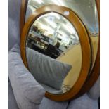 AN OVAL BEVELLED EDGE WALL MIRROR, IN MAHOGANY FRAME