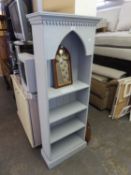 A LIGHT GREY PAINTED WOOD FOUR TIER OPEN BOOKCASE WITH GOTHIC ARCH, 1?11? WIDE