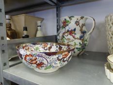 A LARGE FLORAL POTTERY TOILET WATER JUG AND A FLORAL POTTERY FRUIT BOWL (2)