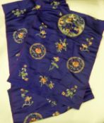 TWO CHINESE ELECTRIC BLUE SHAWLS, each with silk embroidered centre circular dragon medallion and