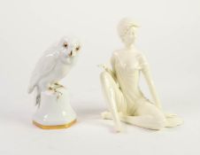 HUTSCHENREUTHER WHITE GLAZED PORCELAIN MODEL OF A FALCON, heightened in gilt, 6 ¼? (15.8cm) high,