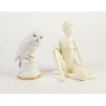 HUTSCHENREUTHER WHITE GLAZED PORCELAIN MODEL OF A FALCON, heightened in gilt, 6 ¼? (15.8cm) high,