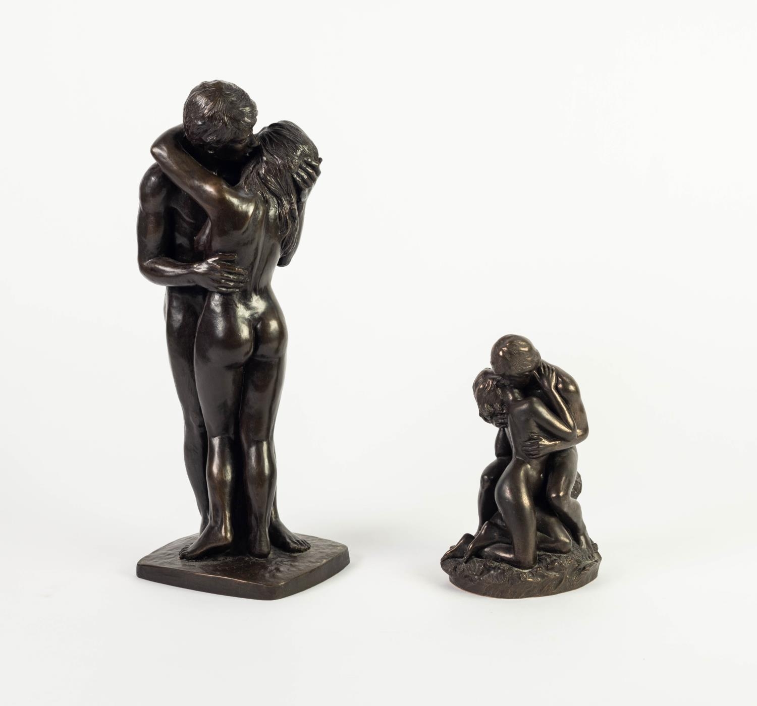 TWO HEREDIITES BRONZED RESIN GROUPS OF NAKED FIGURES EMBRACING One modelled standing, signed ROWLAND