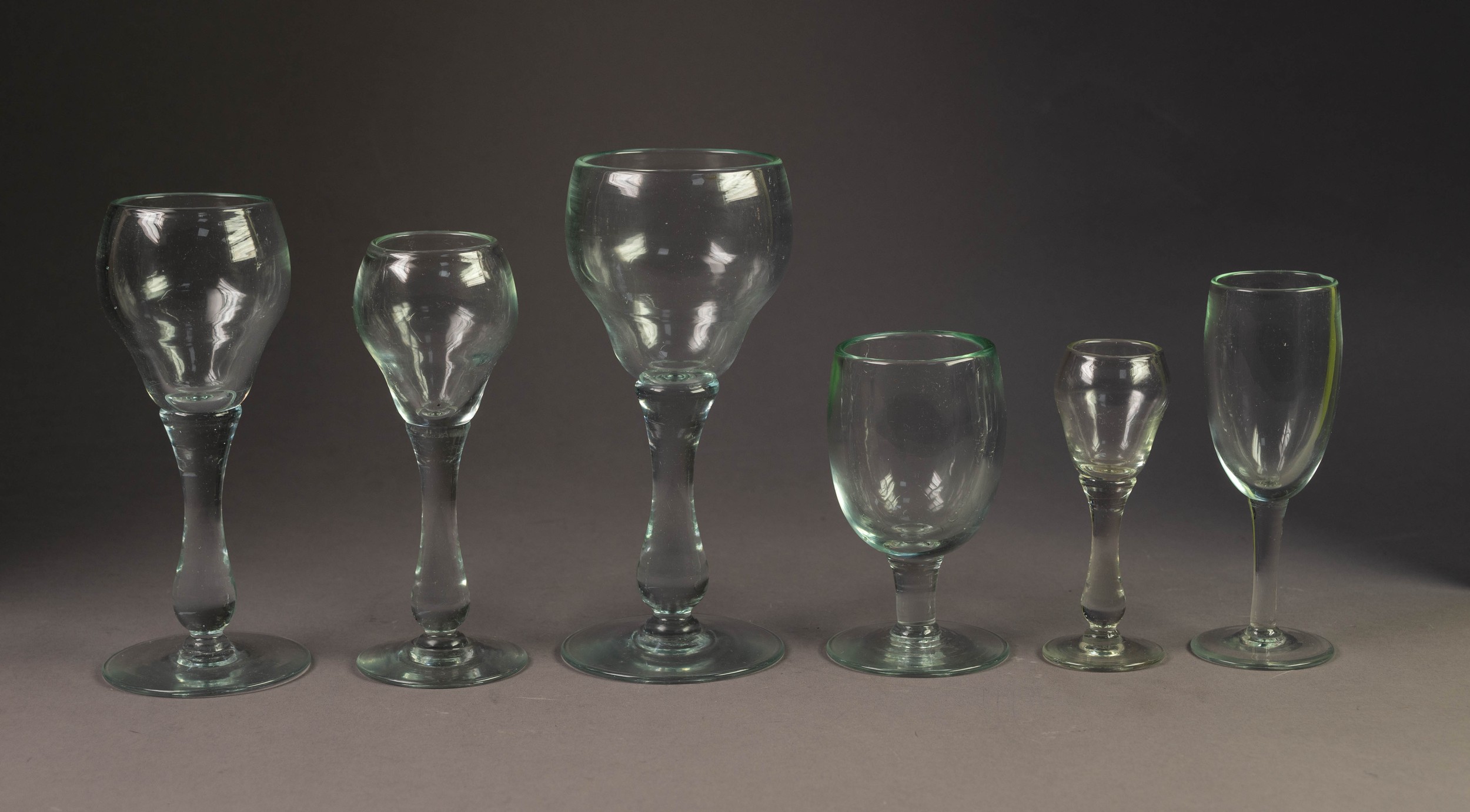 PART SET OF TEN BALUSTER STEMMED WINE GLASSES, each with double ogee bowl and plain foot, 8? (20.