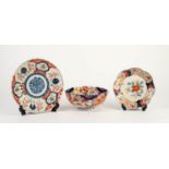 THREE PIECES OF ORIENTAL IMARI PORCELAIN, with floral painted centres and borders, comprising: