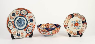 THREE PIECES OF ORIENTAL IMARI PORCELAIN, with floral painted centres and borders, comprising: