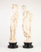 PAIR OF MODERN WHITE COMPOSTION FIGURES OF CLASSICAL FEMALES, on black japanned socles, 25 1/2in (