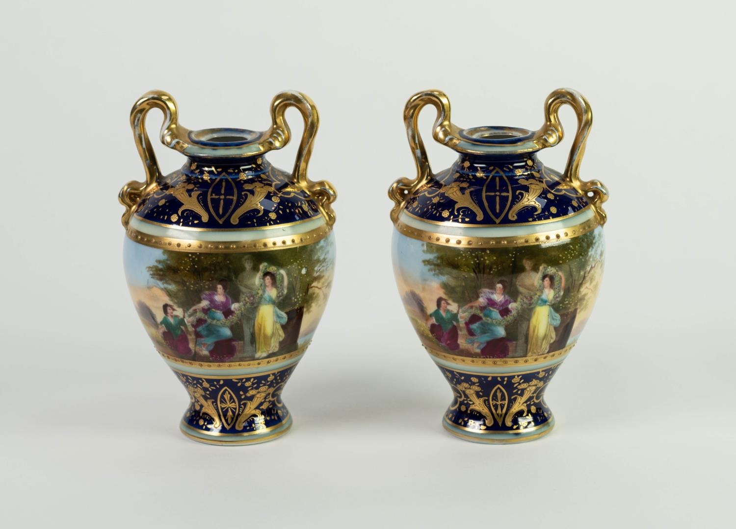 PAIR OF LATE NINETEENTH CENTURY AUSTRIAN PORCELAIN TWO HANDLED VASES, each of ovoid form with high
