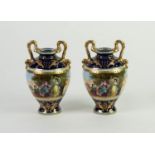 PAIR OF LATE NINETEENTH CENTURY AUSTRIAN PORCELAIN TWO HANDLED VASES, each of ovoid form with high
