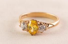 9ct GOLD RING, set with a centre citrine flanked by two white stones, 3.3gms, ring size P