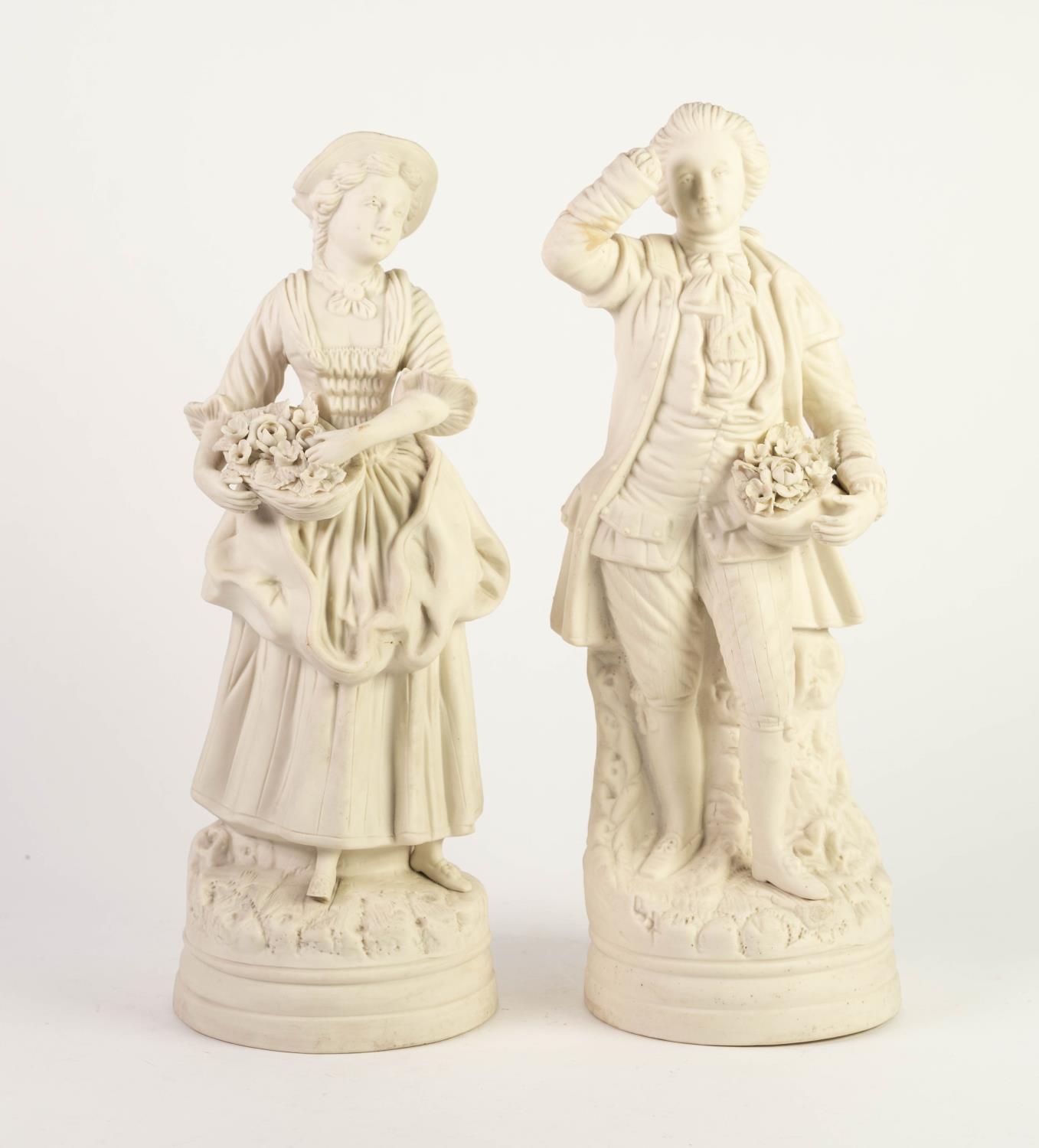 PAIR OF VICTORIAN PARIAN PORCELAIN FIGURES, male and female figures, each carrying flower filled