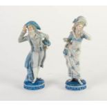 PAIR OF LATE NINETEENTH CENTURY SITZENDORF PORCELAIN FIGURES, heightened in blue and modelled as