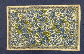 TAPESTRY RUG with all-over design of blue flowers and green foliage on a white field, narrow