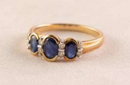 9ct GOLD, SAPPHIRE AND DIAMOND RING, collet set with three oval sapphires and four pairs of tiny