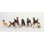 FIVE VARIOUS BESWICK POTTERY FIGURES OF FOALS, IN BROWN GLOSS, one with repaired right foreleg,