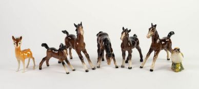 FIVE VARIOUS BESWICK POTTERY FIGURES OF FOALS, IN BROWN GLOSS, one with repaired right foreleg,