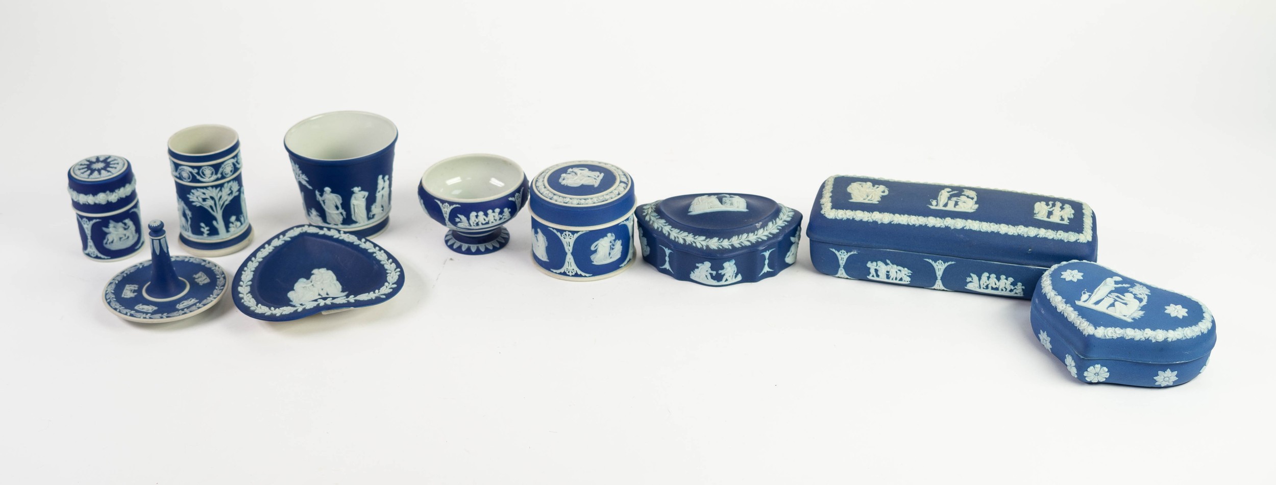 TEN PIECES OF WEDGWOOD DARK BLUE AND WHITE JASPER WARE, to include an oblong box and cover, 7in (