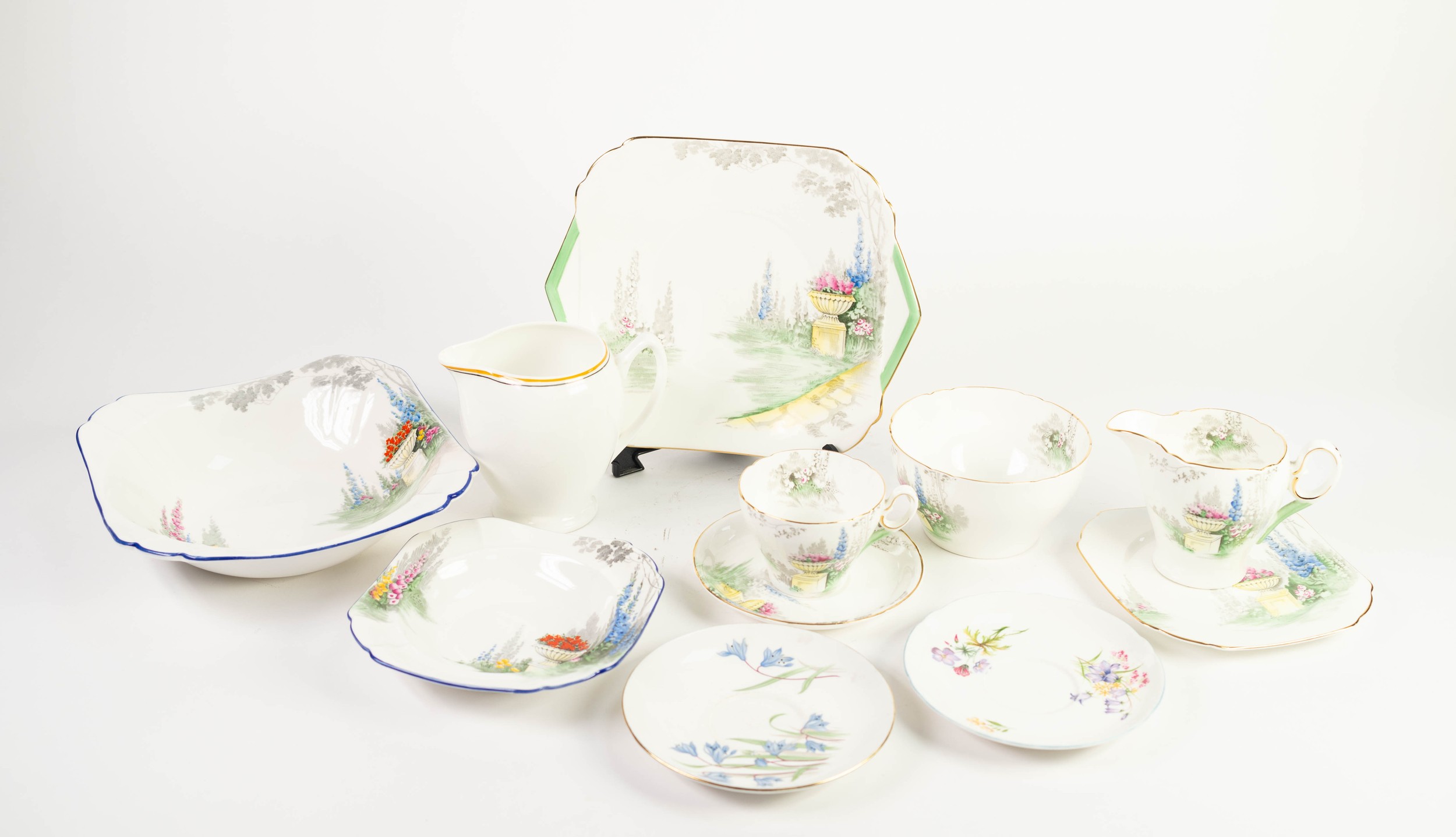 SHELLEY FORMAL GARDEN PATTERN CHINA TEA SET for six persons, including square side plates, a cake