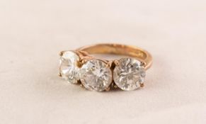 9ct GOLD RING set with a row of three brilliant cut cubic zirconia, 5.7gms, ring size M/N