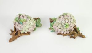 MATCHING PAIR OF NINETEENTH CENTURY GERMAN ?SCHNEEBALLEN? PORCELAIN WALL POCKETS, each painted in