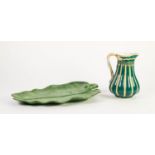 VICTORIAN MELON SHAPED MOULDED POTTERY JUG, of baluster form with entwined scroll handle, glazed