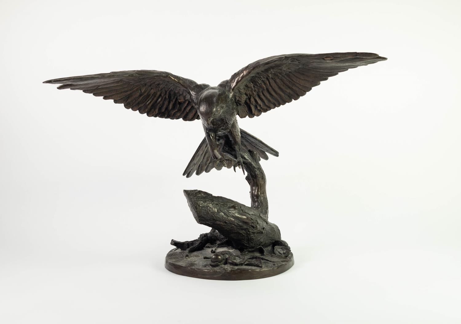 JEANNE RYNHART 1946-2020 BRONZED RESIN SCULPTURE ?Kestrel? modelled about to land on a tree stump