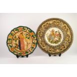 CONTINENTAL MOULDED POTTERY LARGE WALL PLAQUE, painted in colours and decorated to the centre with