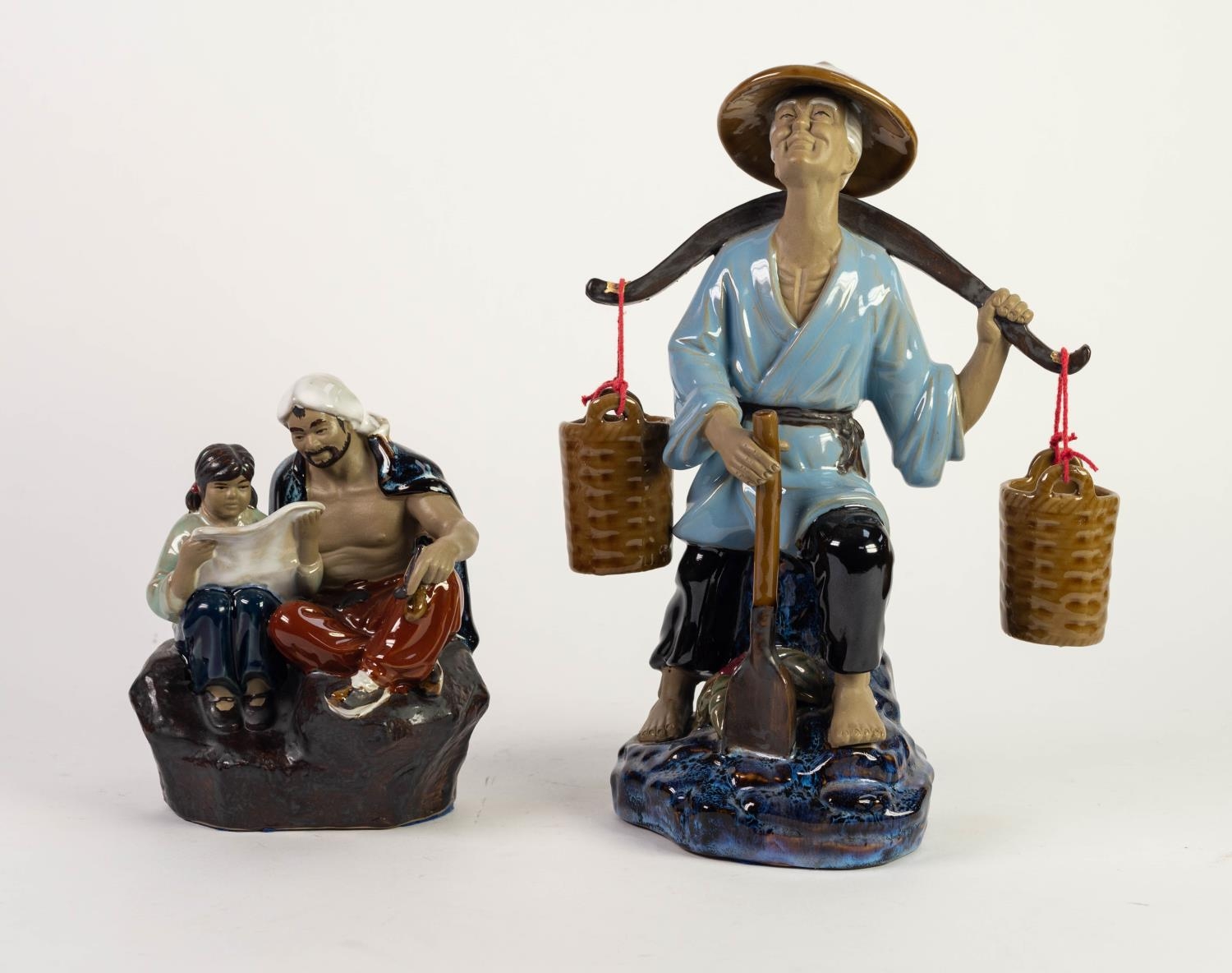 TWO MODERN ORIENTAL PART GLAZED POTTERY FIGURES, one modelled as a seated man and boy reading,