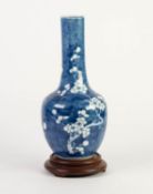 CHINESE BLUE AND WHITE PORCELAIN BOTTLE VASE, painted with prunus on a cracked ice ground, 12? (30.