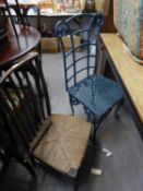 AN EARLY TWENTIETH CENTURY OAK RUSH SEAT TALL BACK SINGLE CHAIR AND A GREEN PAINTED IRON GARDEN