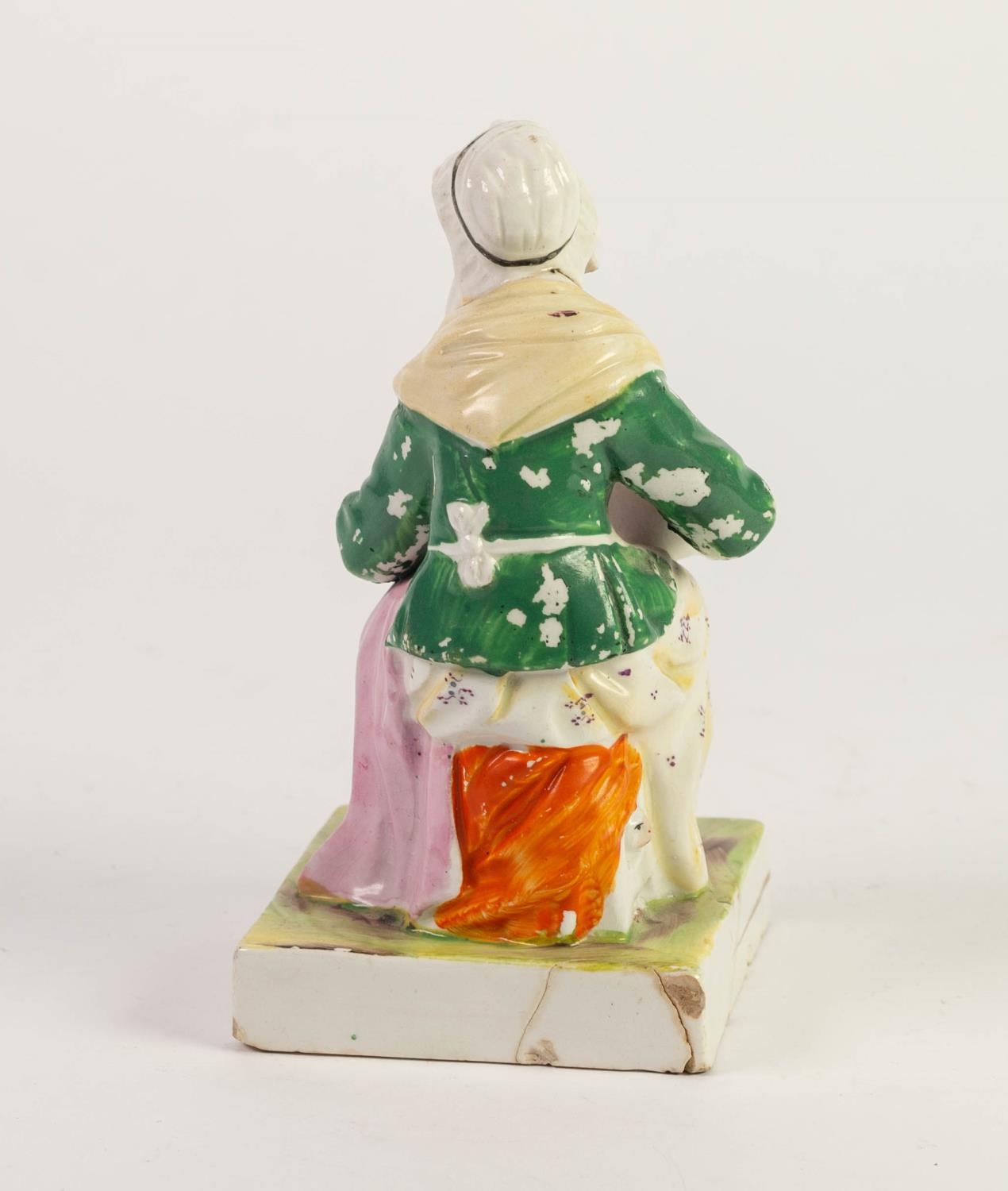 NINETEENTH CENTURY STAFFORDSHIRE POTTERY FIGURE, painted in colours and modelled as a seated maid - Image 2 of 2