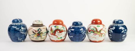 THREE NANKIN BLUE AND WHITE PORCELAIN GINGER JARS AND COVERS, each of typical form and painted