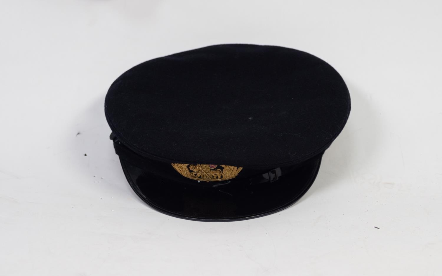 PROBABLY MERCHANT NAVY UNIFORM, the epaulette and arm stripes in purple and gold, viz a cap with - Image 2 of 2