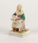 NINETEENTH CENTURY STAFFORDSHIRE POTTERY FIGURE, painted in colours and modelled as a seated maid