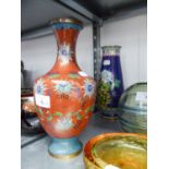 TWO MODERN ORIENTAL CLOISONNÉ VASES, one of ovoid form in red, the other of slender baluster form in