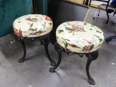 PAIR OF VICTORIAN/ EDWARDIAN BLACK PAINTED CAST IRON CIRCULAR BAR STOOLS, with later cowboy themed