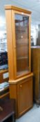 WILLIAM MORRIS FURNITURE, TEAK DOUBLE CORNER CUPBOARD, WITH GLAZED UPPER DOOR ENCLOSING THREE