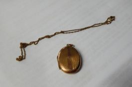 FINE 9ct GOLD CHAIN AND AN ENGINE TURNED OVAL LOCKET WITH ?9CT BACK & FRONT?, (2)