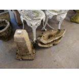 AN EMBOSSED STONE TAPERING GARDEN BASE AND BROKEN BIRDBATH TOP