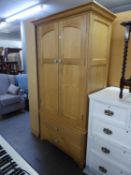 A MODERN VICTORIAN STYLE LIGHT OAK TWO DOOR WARDROBE WITH TWO LONG DRAWERS BELOW, 3?5? WIDE