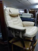 A CREAM HIDE EASY ARMCHAIR, REVOLVING ON A WOODEN FIVE SPUR BASE