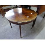A FRAMED MAHOGANY CIRCULAR OCCASIONAL TABLE RAISED ON SLENDER SUPPORTS (A.F.)