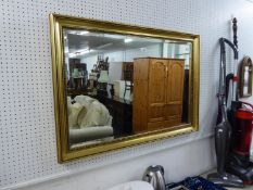 AN OBLONG FRAMED WALL MIRROR (100cm x 70cm)