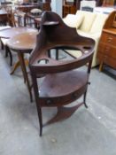 A VICTORIAN THREE TIER CORNER WASHSTAND, THE TOP HAVING THREE CIRCULAR HOLES (LACKING WASH BOWL),