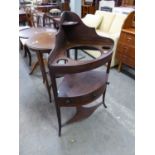 A VICTORIAN THREE TIER CORNER WASHSTAND, THE TOP HAVING THREE CIRCULAR HOLES (LACKING WASH BOWL),