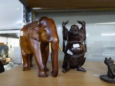 CARVED WOOD FIGURE OF HOTEII, with arms raised, and a HARDWOOD MODEL OF AN ELEPHANT, 9 ½? high, (2)