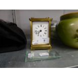 A BRASS CARRIAGE CLOCK (CASE WITH TWO GLASS PANELS MISSING)
