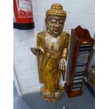A FLOOR STANDING SOFTWOOD FIGURE OF A BUDDHA, PAINTED MAINLY IN GOLD (A.F.)