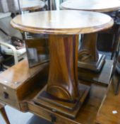 A CIRCULAR COFFEE TABLE, THE COLUMN FORMED FROM AN AIRCRAFT PROPELLER, ON SQUARE BASE